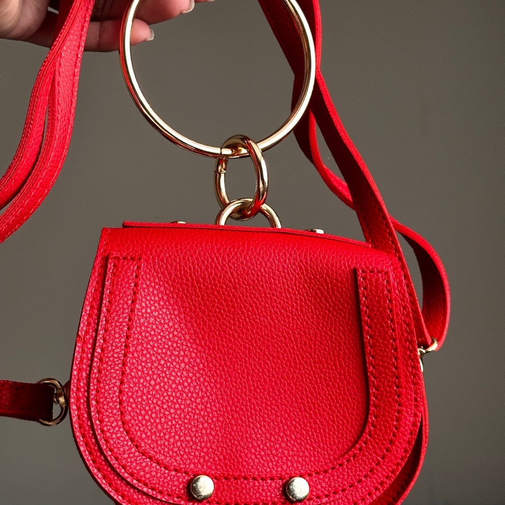 Red crossbody purse with gold handle